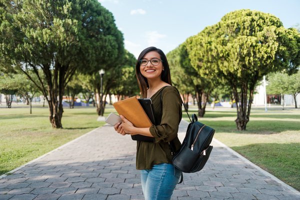 College student on campus with her supplies, iPad carrying cases concept