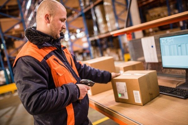 male-worker-using-barcode-scanners-in-a-warehouse