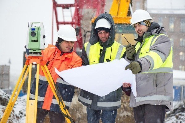 engineers-wearing-equipment-at-a-construction-site-in-winter-season