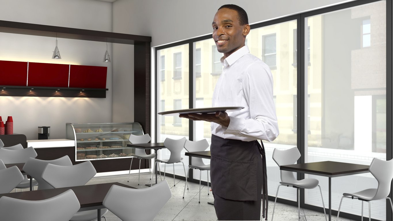 waiter-with-server-apron-holding-empty-tray